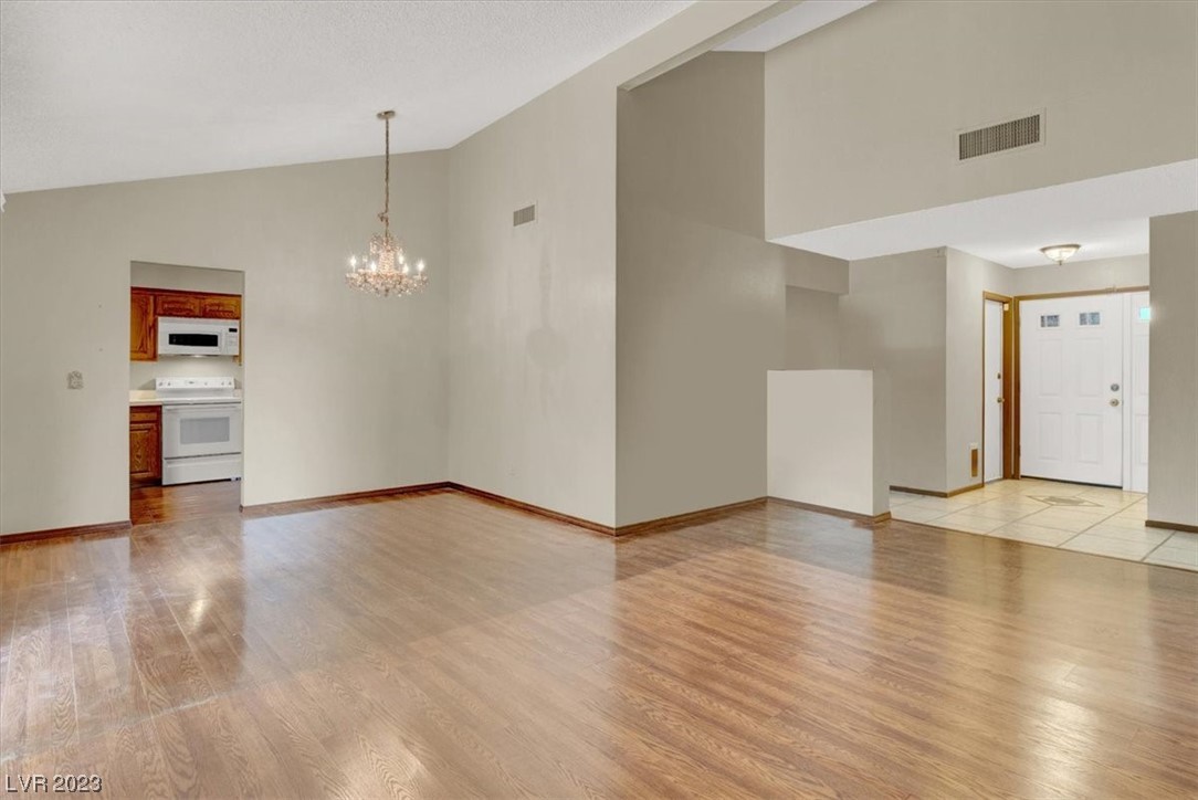1407 Bronco Road Boulder City, NV 89005 - Photo 8 of 38 Formal Dinig Room and kitchen to left of family ro