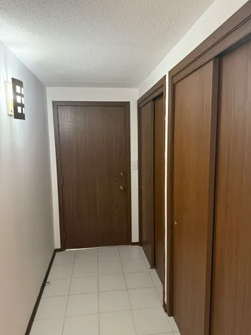 a view of a balcony with wooden floor