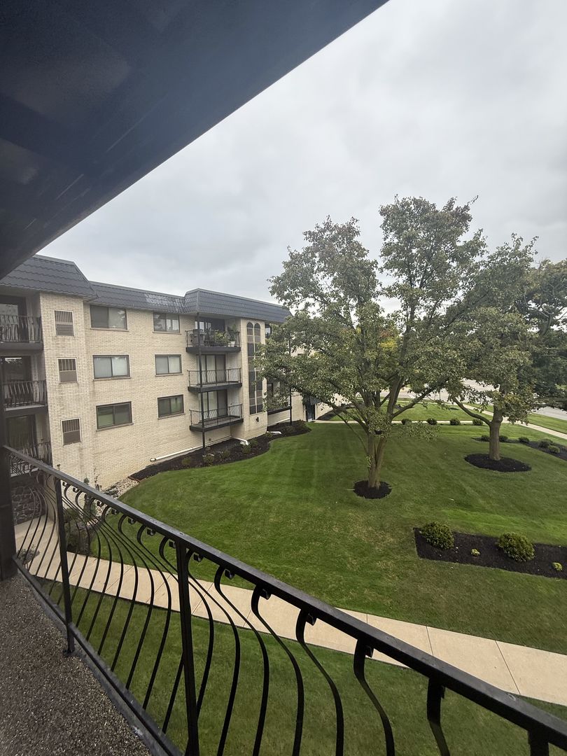 6950 West Forest Preserve Drive, Unit 202 Norridge, IL 60706 - Photo 2 of 15 a view of a porch with a yard