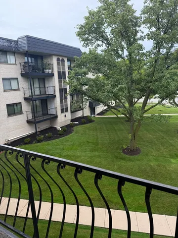 a view of swimming pool from a balcony