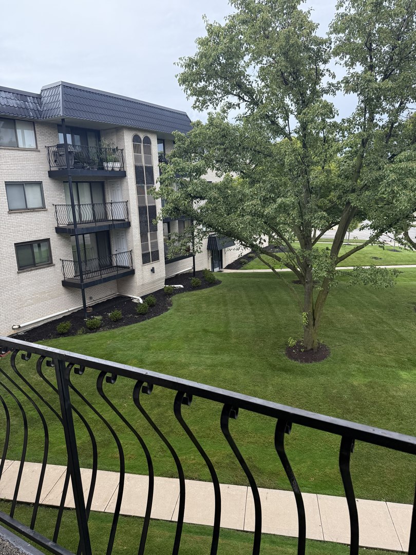 6950 West Forest Preserve Drive, Unit 202 Norridge, IL 60706 - Photo 3 of 15 a view of swimming pool from a balcony