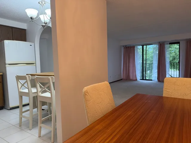 a view of a livingroom with furniture and windows