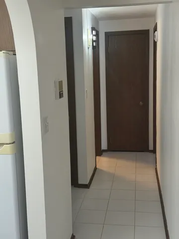 a view of a hallway to rooms