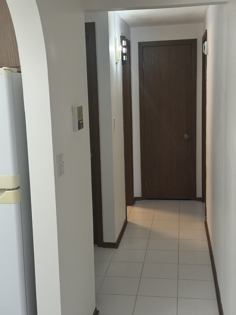 6950 West Forest Preserve Drive, Unit 202 Norridge, IL 60706 - Photo 7 of 15 a view of a hallway to rooms
