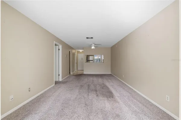 a view of an empty room with a window