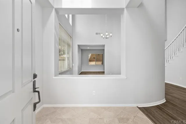 a bathroom with a window and a shower