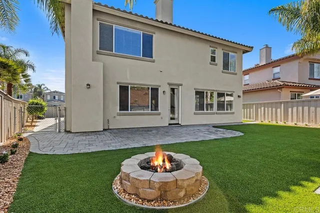 a kitchen with a stove and a chair