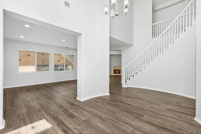 a view of an entryway with wooden floor