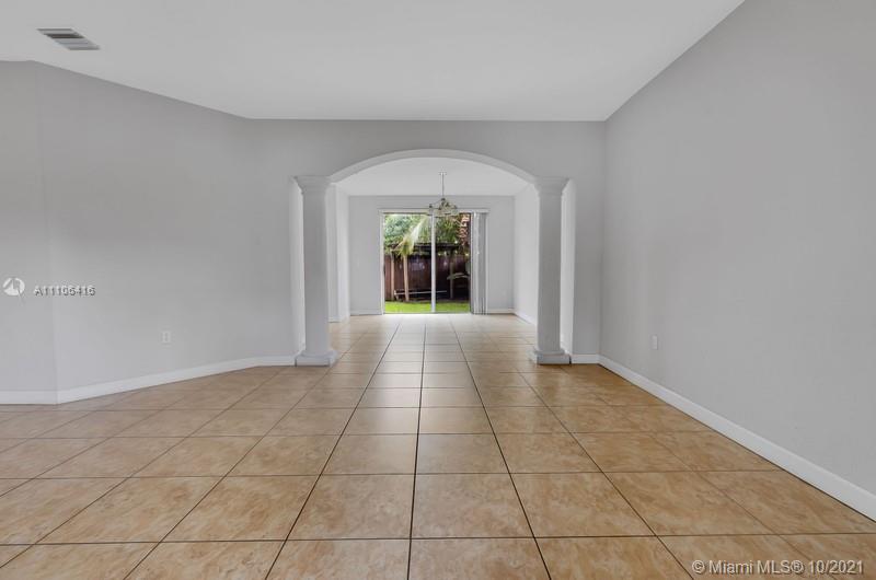 4131 Southwest 154th Court Miami, FL 33185 - Photo 13 of 36 wooden floor in a hallway with a livingroom