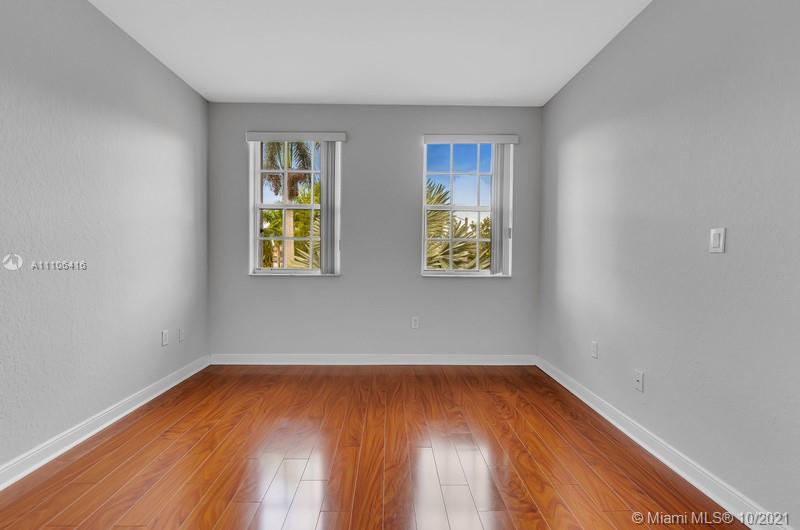 4131 Southwest 154th Court Miami, FL 33185 - Photo 17 of 36 an empty room with a window and wooden floor