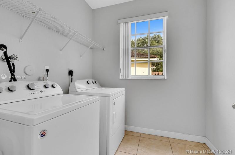 4131 Southwest 154th Court Miami, FL 33185 - Photo 28 of 36 a utility room with dryer and washer