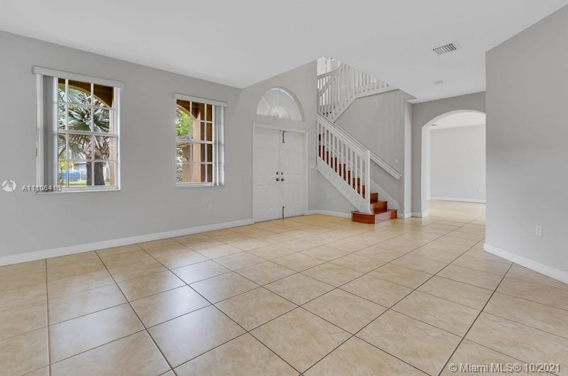 4131 Southwest 154th Court Miami, FL 33185 - Photo 3 of 36 a view of entryway and hall with a window