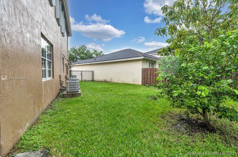 4131 Southwest 154th Court Miami, FL 33185 - Photo 32 of 36 a view of backyard of house with green space