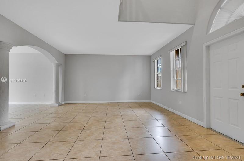 4131 Southwest 154th Court Miami, FL 33185 - Photo 4 of 36 a view of an empty room and window