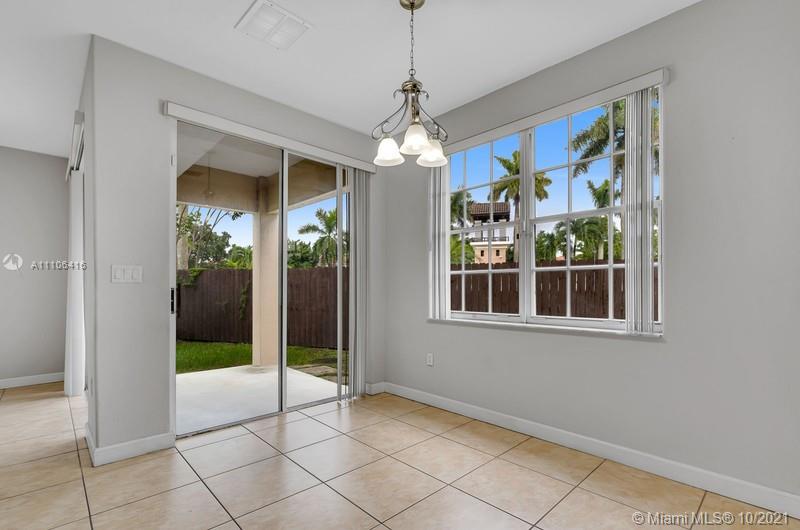 4131 Southwest 154th Court Miami, FL 33185 - Photo 5 of 36 a view of an entryway with a chandelier