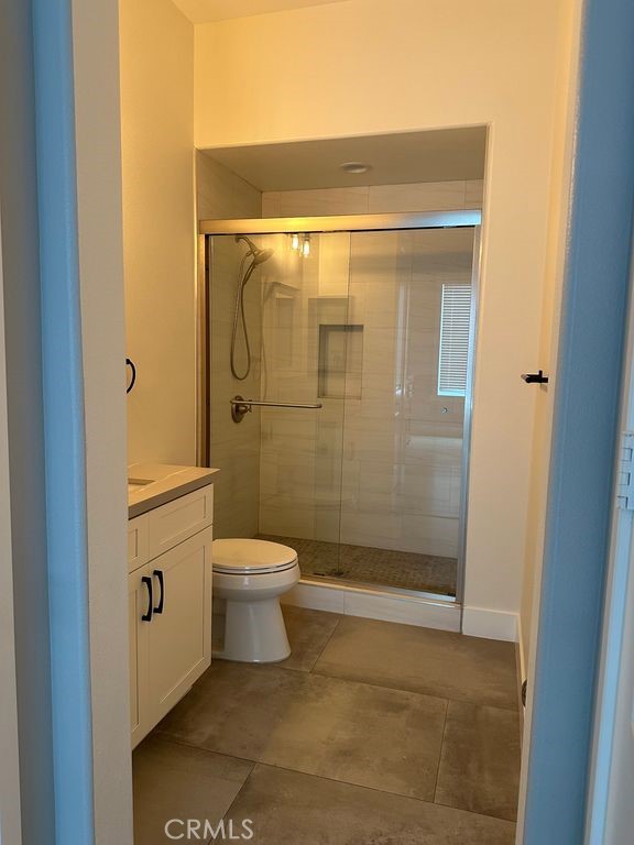 31913 St Joseph Lane Stanton, CA 90680 - Photo 9 of 12 a bathroom with a toilet and shower