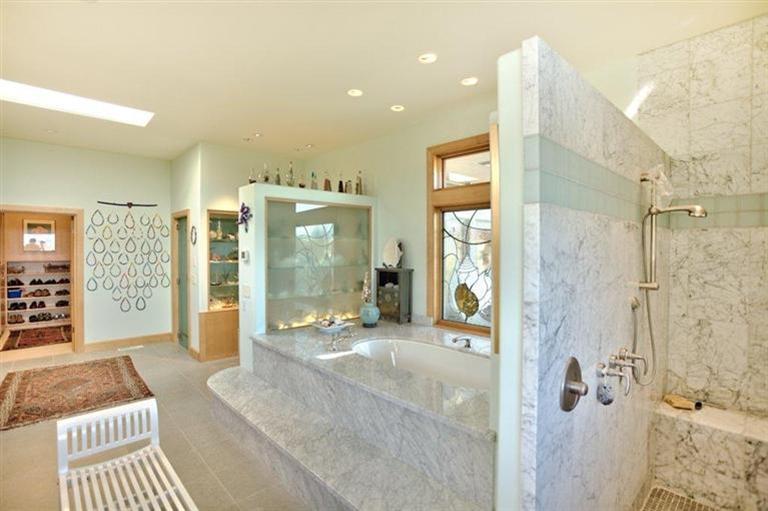 3346 Old Military Road Central Point, OR 97502 - Photo 14 of 24 a bathroom with a glass shower door and a bathtub