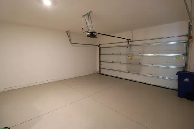 a view of a house with swimming pool and sitting area