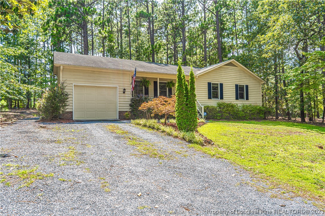 3 Red Cedar Lane Pinehurst, NC 28374 - Photo 1 of 20 a front view of house with yard and trees around