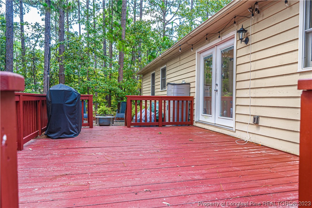 3 Red Cedar Lane Pinehurst, NC 28374 - Photo 16 of 20 a view of backyard with deck and outdoor seating