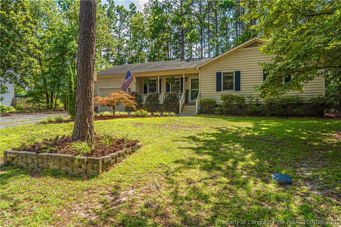 3 Red Cedar Lane Pinehurst, NC 28374 - Photo 2 of 20 a front view of a house with garden