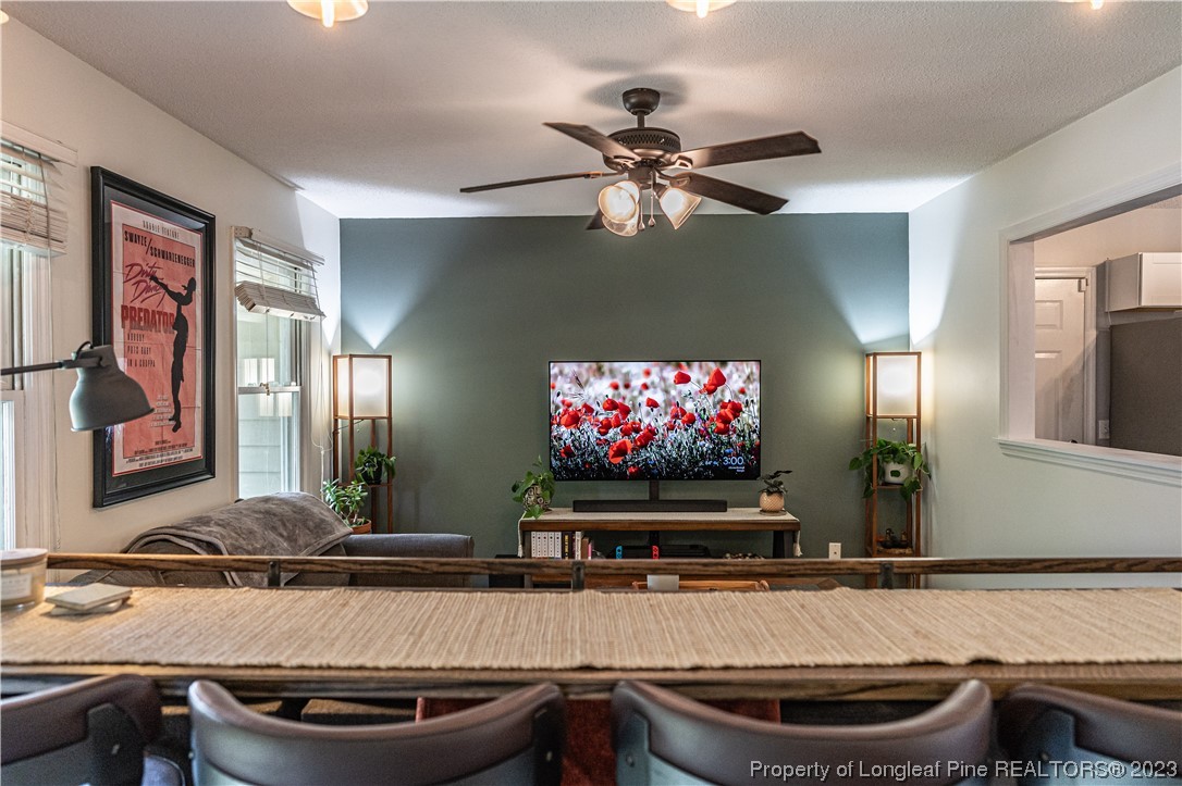 3 Red Cedar Lane Pinehurst, NC 28374 - Photo 4 of 20 a room with furniture a flat screen tv and a chandelier