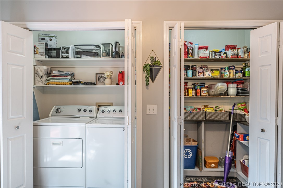 3 Red Cedar Lane Pinehurst, NC 28374 - Photo 8 of 20 a room with a refrigerator and cabinets