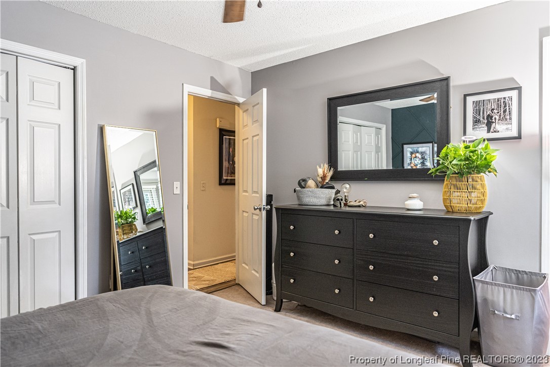 3 Red Cedar Lane Pinehurst, NC 28374 - Photo 10 of 20 a bedroom with a bed and a dresser