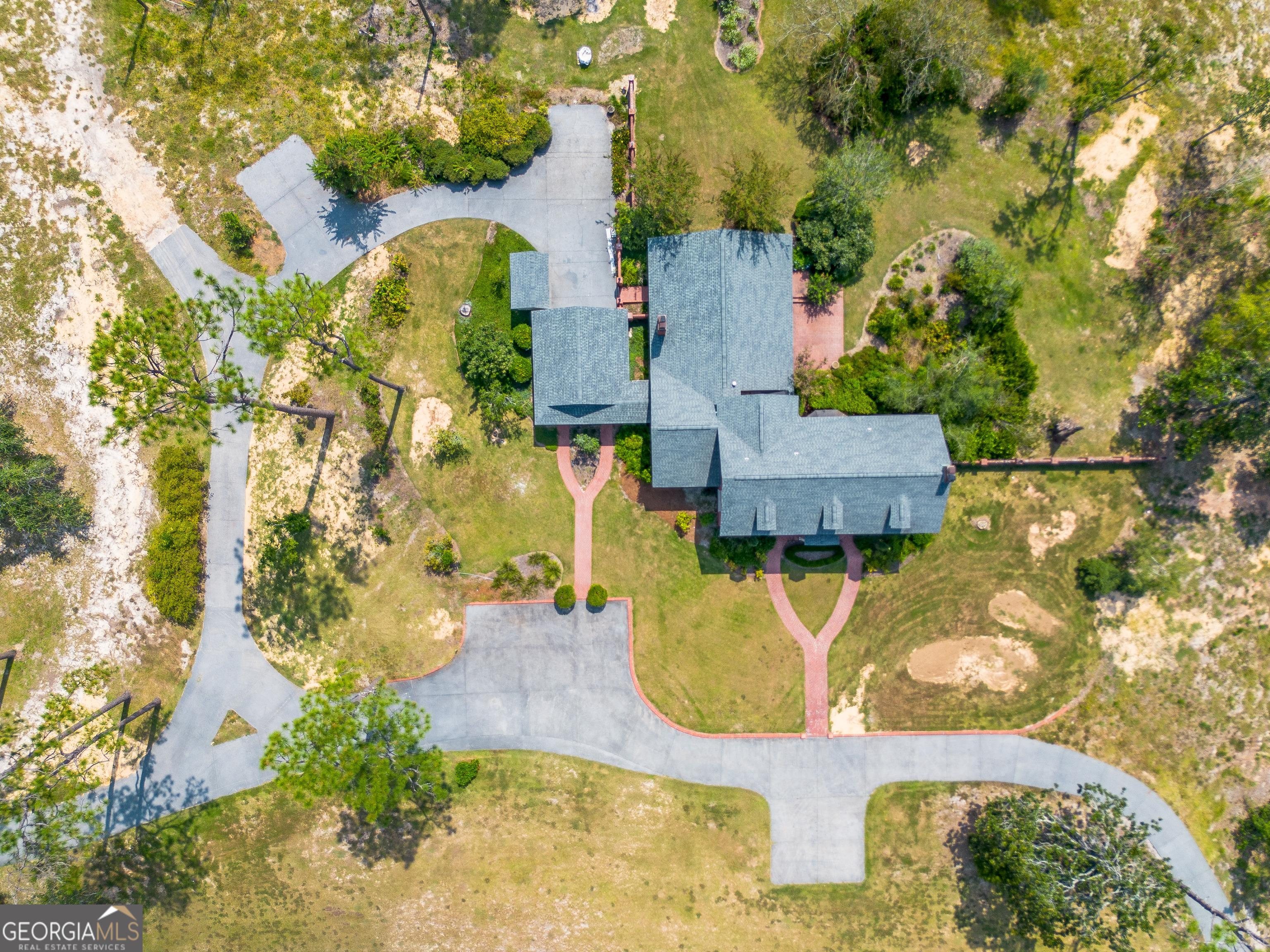 1602 Ward St Extension West Douglas, GA 31533 - Photo 5 of 70 an aerial view of a house with swimming pool and large trees