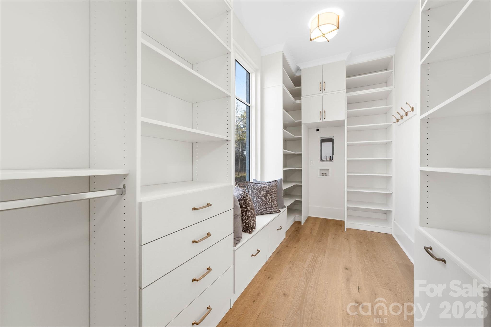 216 Walnut Street Davidson, NC 28036 - Photo 22 of 48 a view of walk in closet with empty racks
