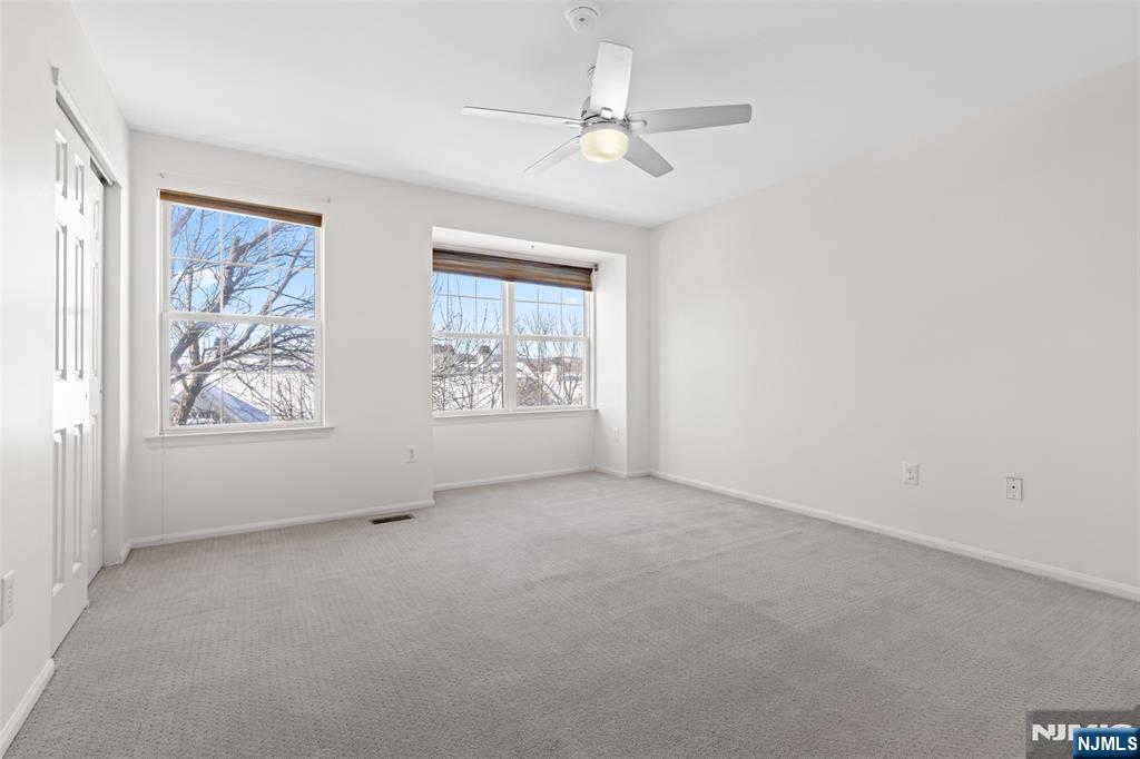 2384 Quill Court Mahwah, NJ 07430 - Photo 13 of 31 an empty room with windows and fan