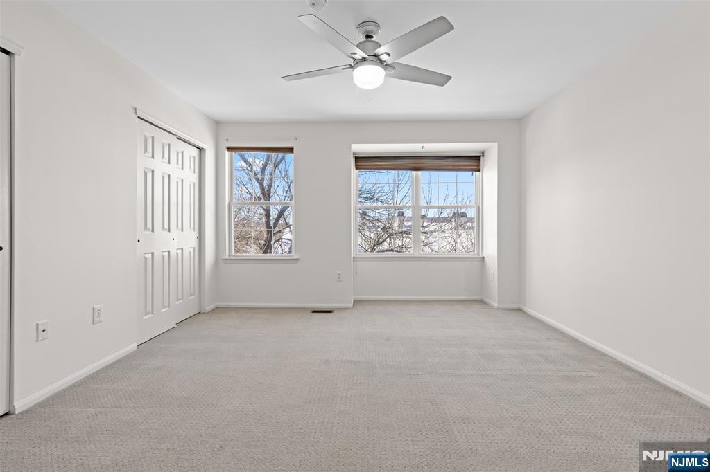 2384 Quill Court Mahwah, NJ 07430 - Photo 14 of 31 an empty room with windows and fan