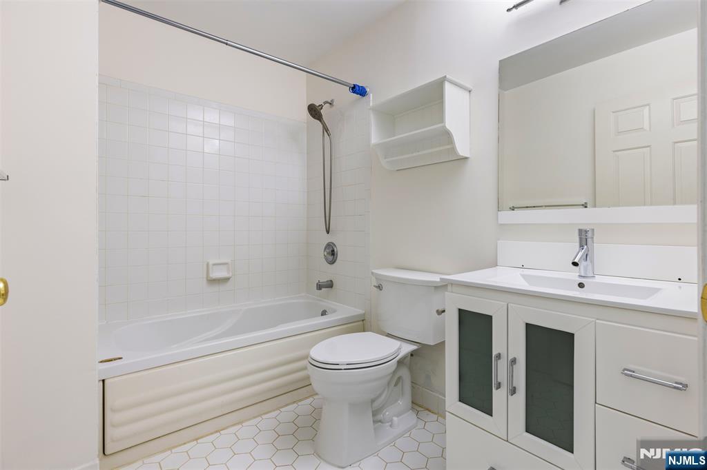 2384 Quill Court Mahwah, NJ 07430 - Photo 19 of 31 a bathroom with a toilet sink and shower