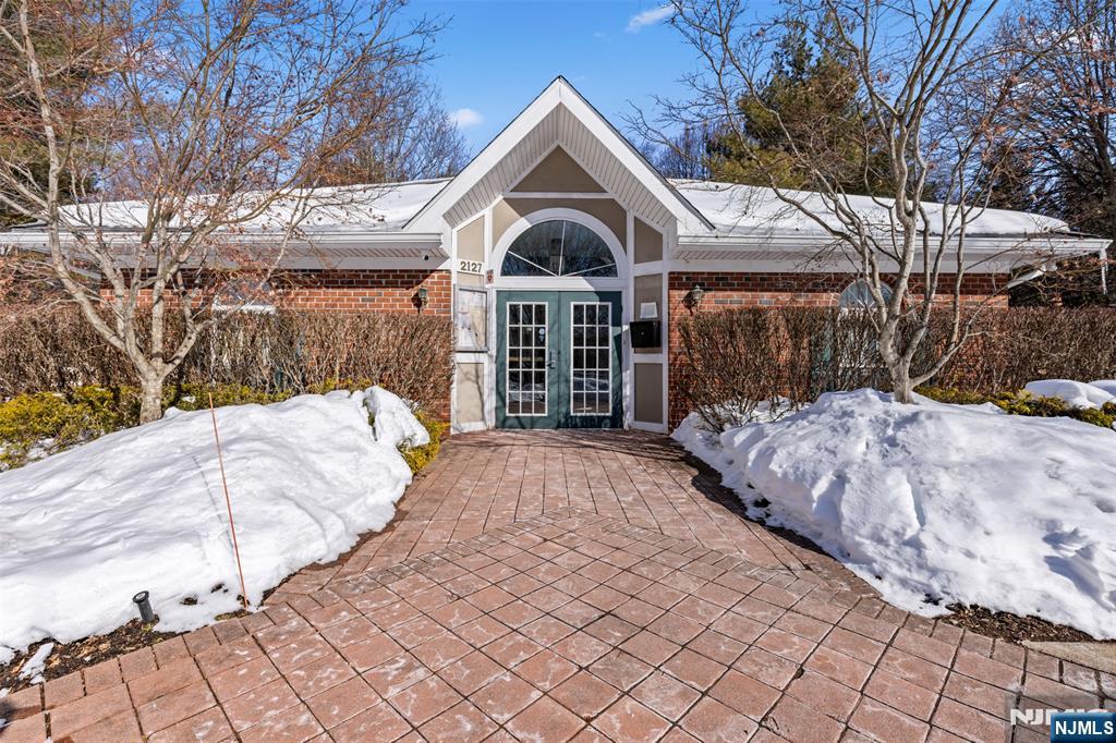 2384 Quill Court Mahwah, NJ 07430 - Photo 24 of 31 a front view of a house with a yard and garage