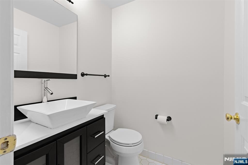 2384 Quill Court Mahwah, NJ 07430 - Photo 9 of 31 a bathroom with a sink toilet and vanity