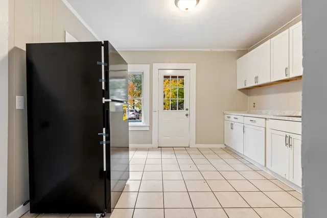 a kitchen with a sink and a refrigerator
