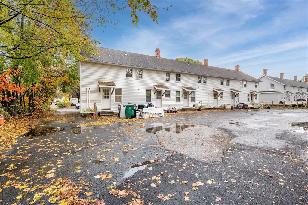 14-24 C Street, Unit 14 Northbridge, MA 01588 - Photo 4 of 25 a view of road with card and parked