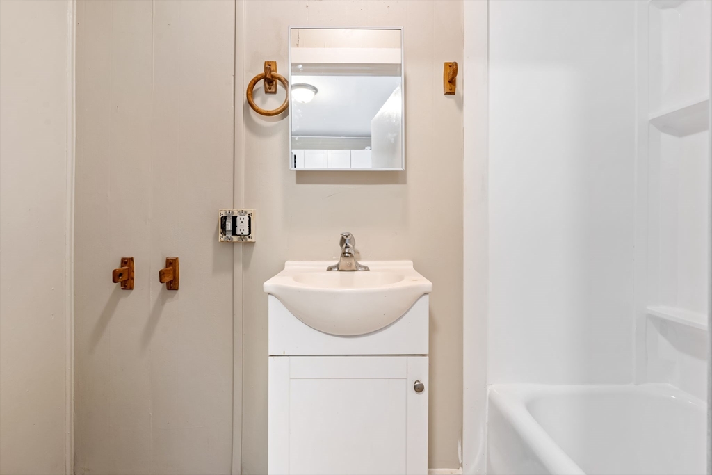 14-24 C Street, Unit 14 Northbridge, MA 01588 - Photo 8 of 25 a bathroom with a sink a toilet and a bathtub