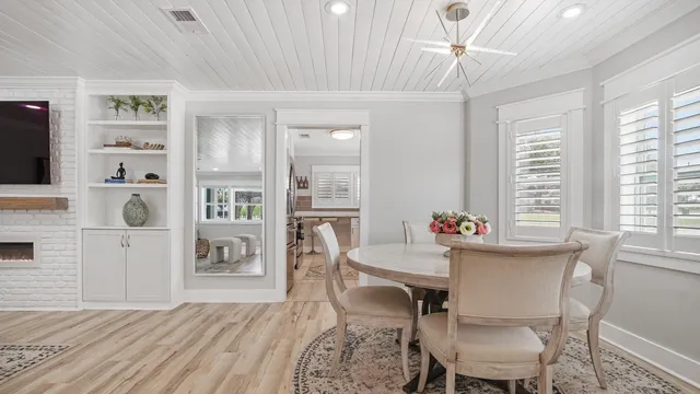 a workspace with furniture window and wooden floor