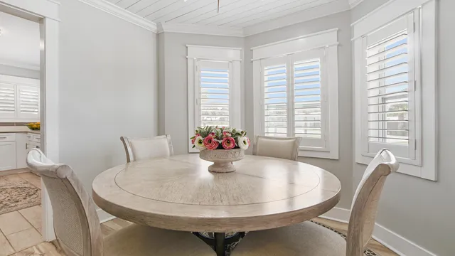 a dining room with furniture and wooden floor