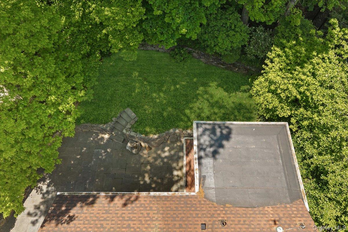 311 Lyncroft Road New Rochelle, NY 10804 - Photo 33 of 39 a view of a pathway both side of building