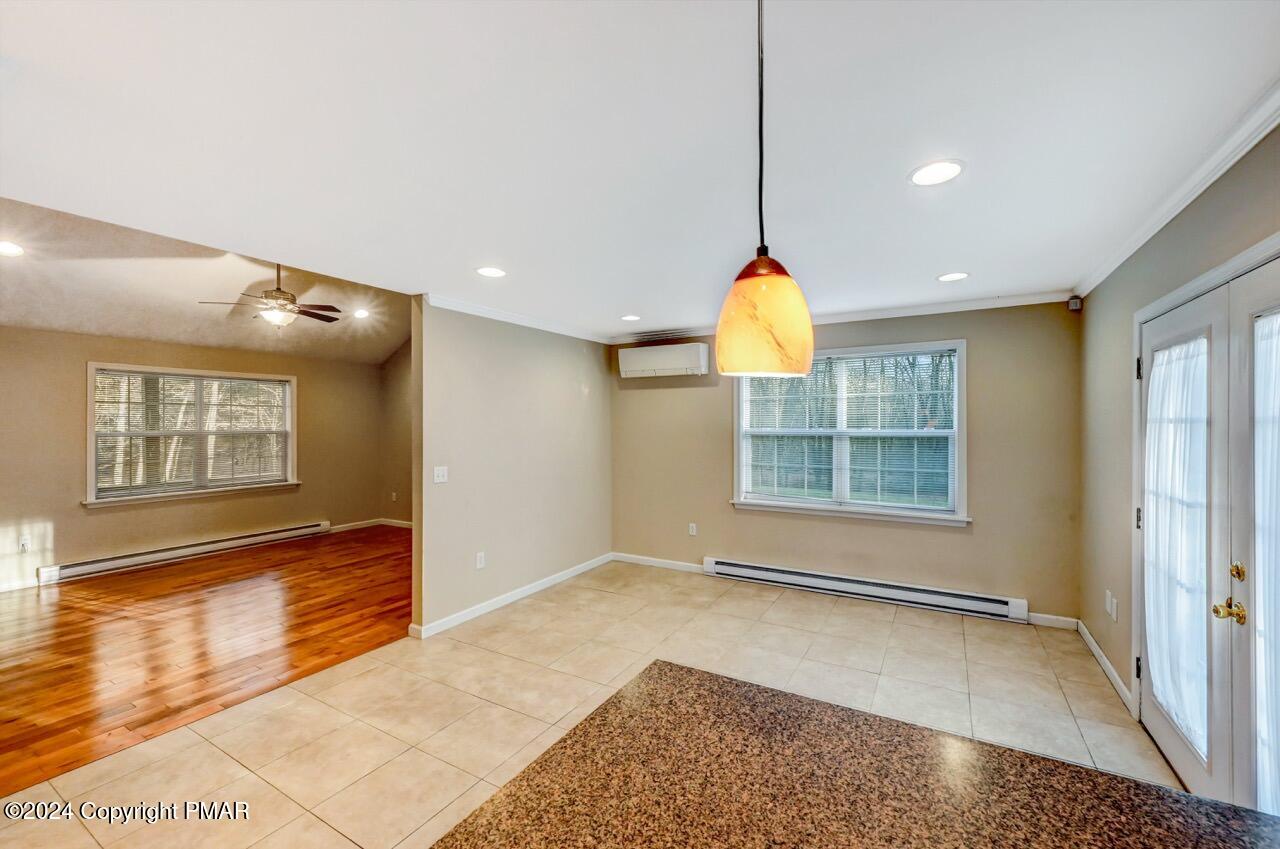 119 Woodland Road Albrightsville, PA 18210 - Photo 12 of 45 a view of an empty room with window and chandelier fan