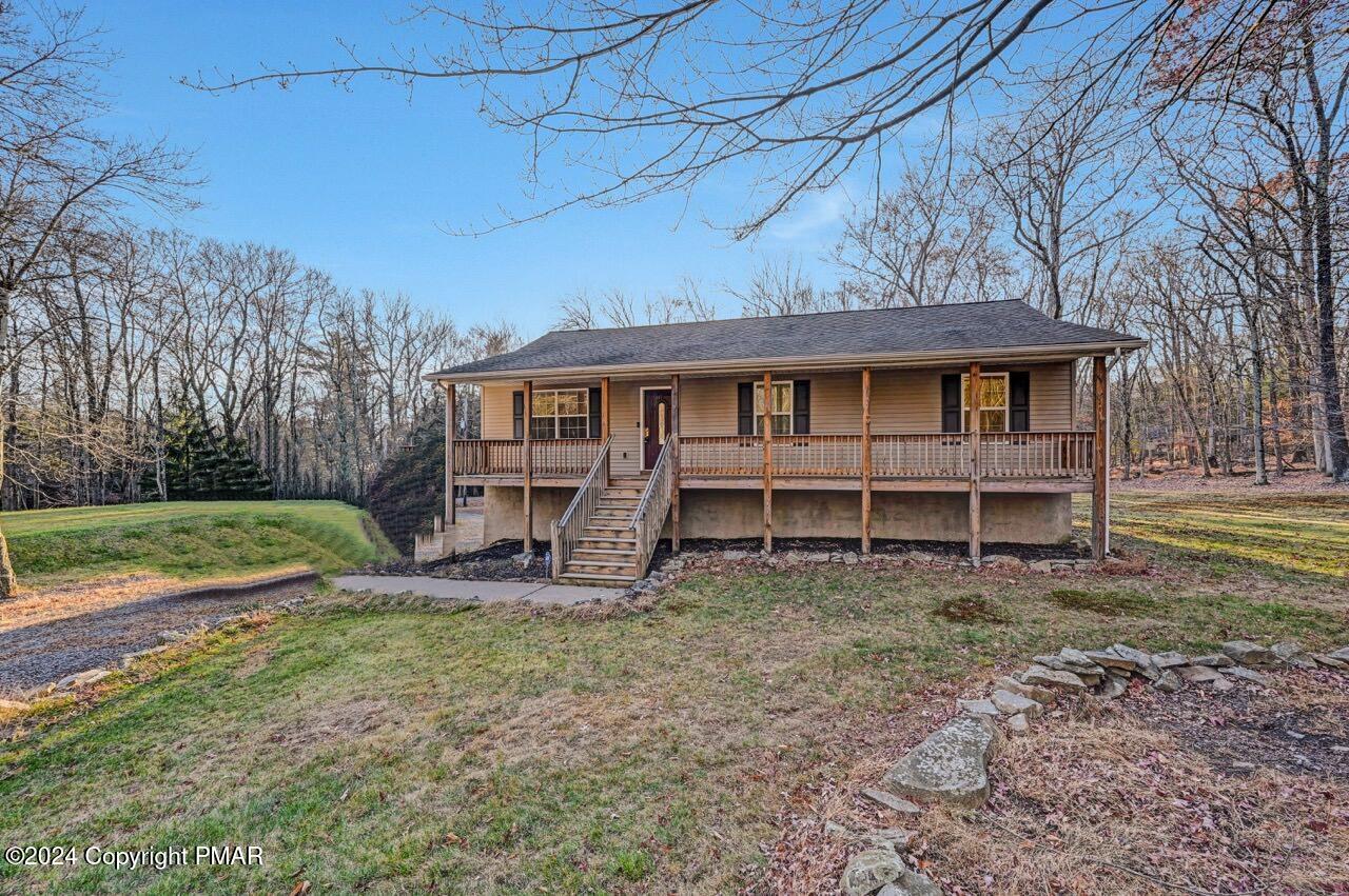 119 Woodland Road Albrightsville, PA 18210 - Photo 2 of 45 a view of a house with backyard and sitting area