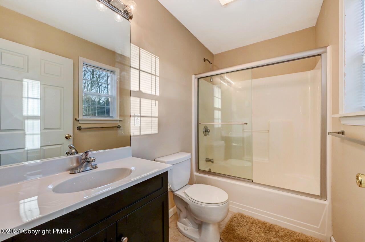 119 Woodland Road Albrightsville, PA 18210 - Photo 22 of 45 a bathroom with a sink toilet a mirror and shower