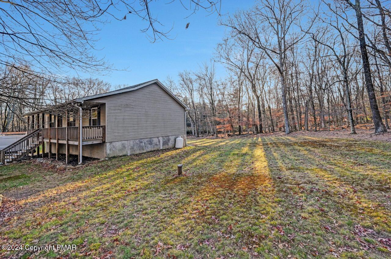119 Woodland Road Albrightsville, PA 18210 - Photo 37 of 45 a view of a backyard with wooden fence