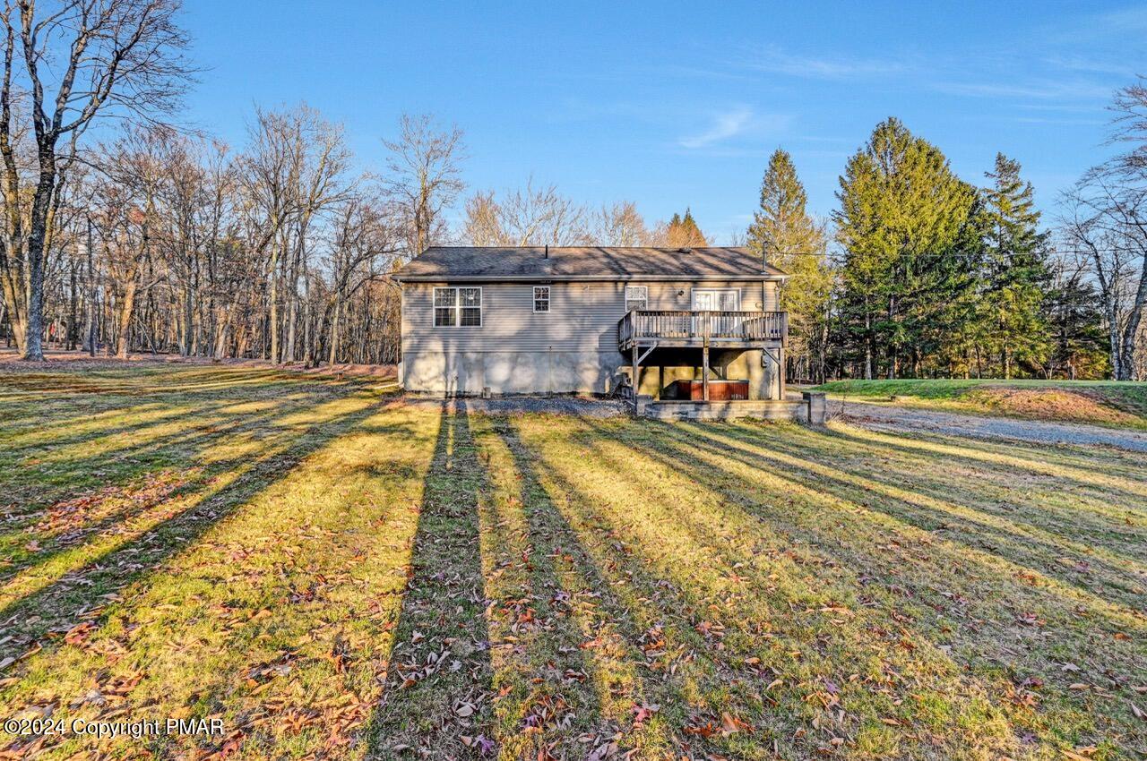 119 Woodland Road Albrightsville, PA 18210 - Photo 39 of 45 a view of a swimming pool with an outdoor space and seating area