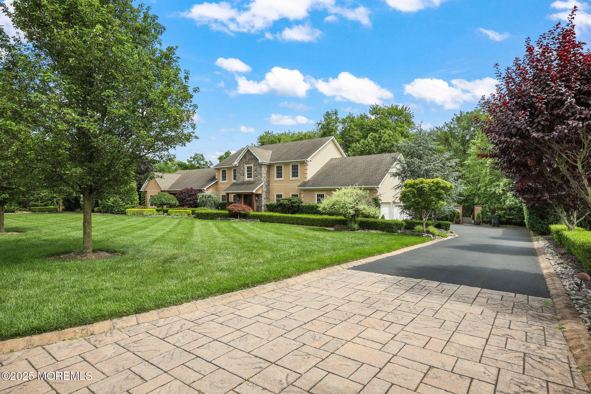 4 White Pines Way Freehold, NJ 07728 - Photo 1 of 66 a view of a garden with a house in the background