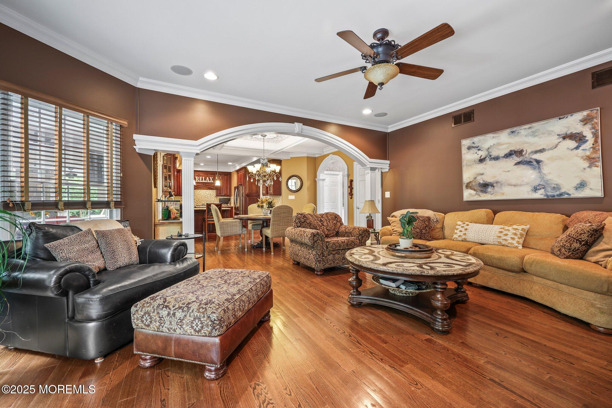 4 White Pines Way Freehold, NJ 07728 - Photo 18 of 66 a living room with furniture ceiling fan and a large window