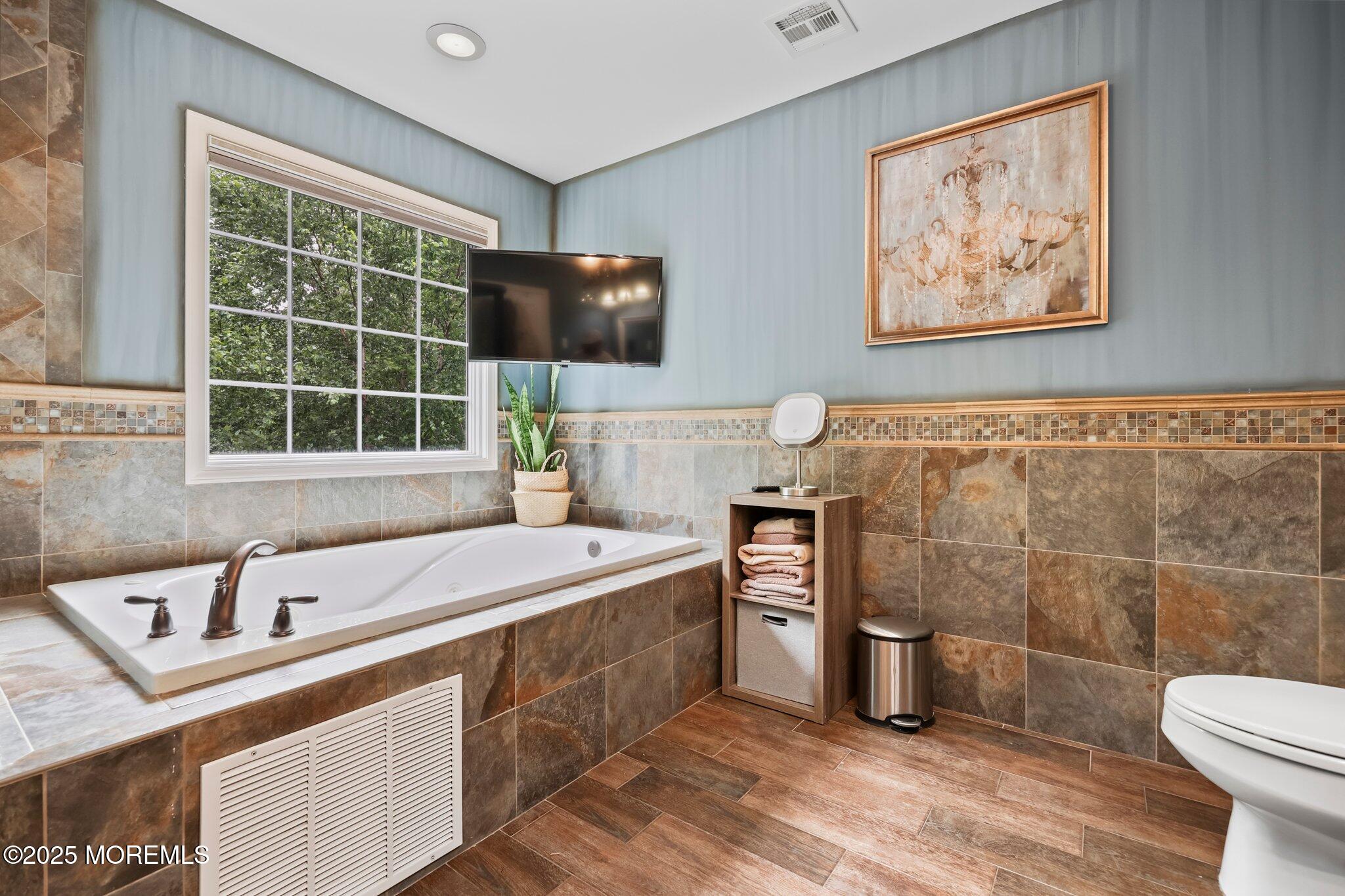 4 White Pines Way Freehold, NJ 07728 - Photo 27 of 66 a bathroom with a sink a toilet and shower