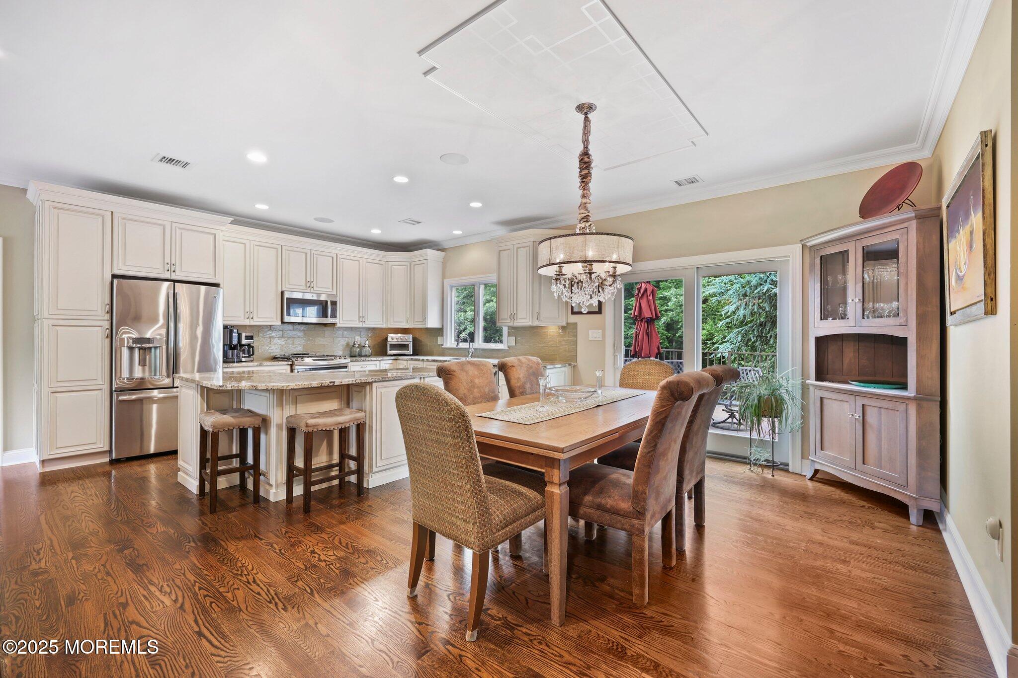 4 White Pines Way Freehold, NJ 07728 - Photo 45 of 66 a view of a dining room with furniture kitchen and chandelier